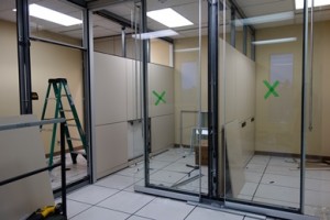 The glass walls being installed in the lab