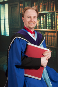 Photo of Alain Forget in PhD graduation gown