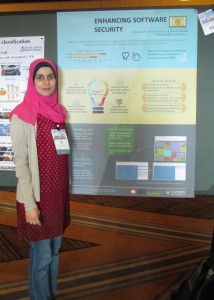 Hala standing next to her poster at the 2016 CRA-W poster session