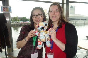 Leah and Sonia posing with the IDC bear in Manchester UK