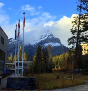 Photo taken in Banff with view of the mountains in the background and buildings in the foreground