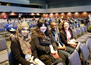 Yomna, Jessica, Michael, Daniela sitting in the auditorium for the CHI2018 opening keynote