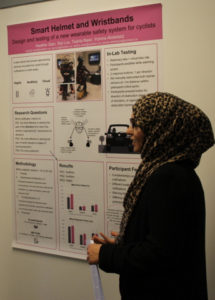 Yomna presenting her poster at the CLUE Symposium