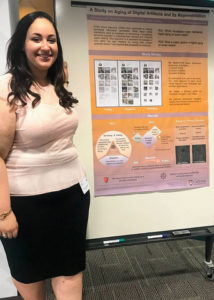 Reham and her poster at the CLUE Symposium