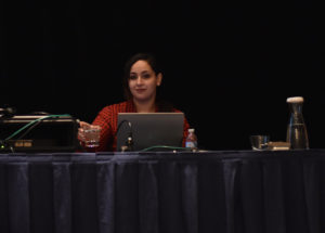 Reham Mohamed on stage, presenting her work at SOUPS 2018