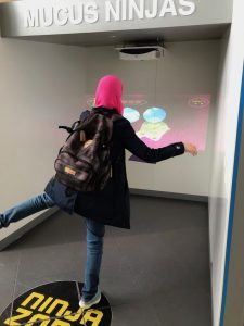 Hala playing a game at the CHI 2019 reception held at the Science Museum in Glasgow