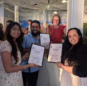 Ananta, Zaid, and Sana holding up certificates for an IDC Honourable Mention awad